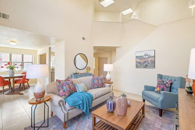 living area with light tile patterned flooring and visible vents