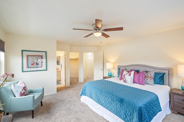 carpeted bedroom featuring a closet, baseboards, ceiling fan, and a spacious closet