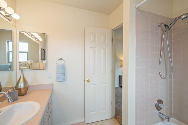 bathroom featuring shower / washtub combination and vanity