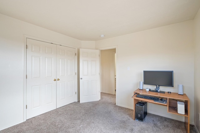 office area featuring baseboards and carpet floors