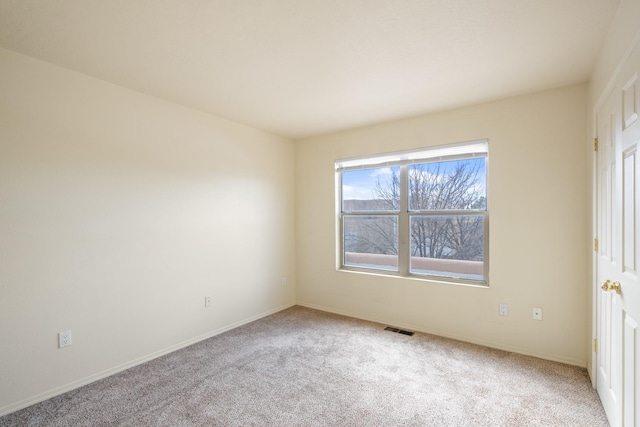 unfurnished bedroom with visible vents, carpet flooring, and baseboards