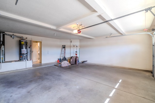 garage featuring secured water heater, a garage door opener, and baseboards