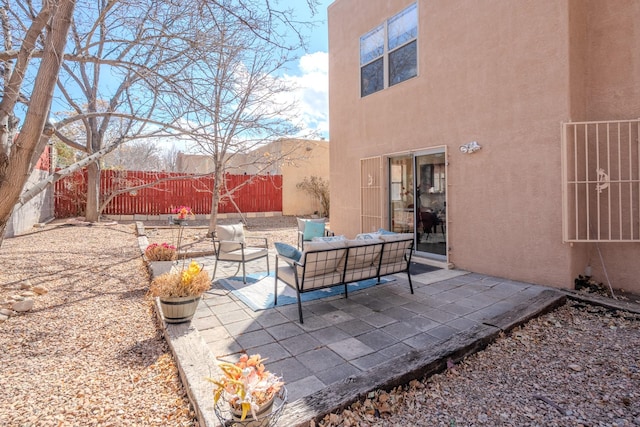 view of patio / terrace featuring an outdoor hangout area and a fenced backyard