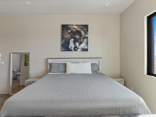 bedroom featuring wood finished floors