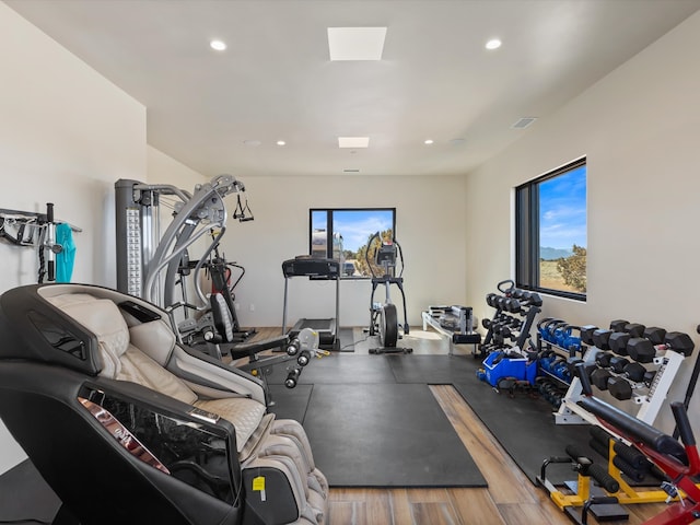 exercise room with recessed lighting and visible vents