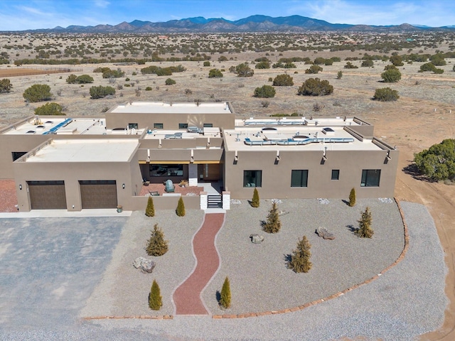 aerial view with a mountain view and a desert view