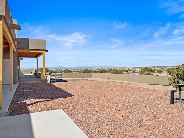 view of yard featuring a patio area and fence