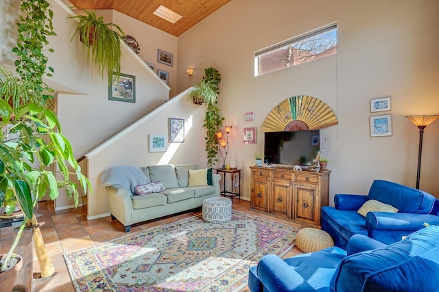 living room with stairway, baseboards, high vaulted ceiling, and wooden ceiling