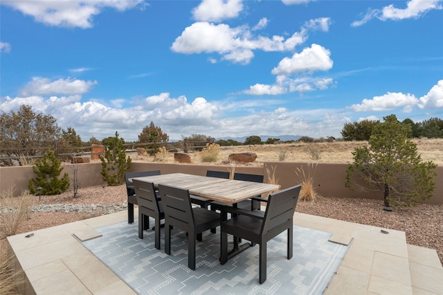 view of patio / terrace with outdoor dining area and a fenced backyard