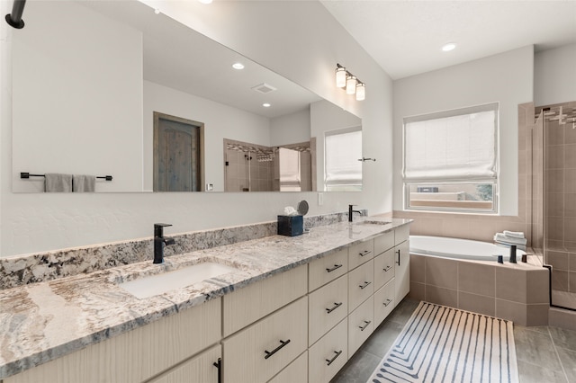 bathroom with a sink, visible vents, double vanity, and a shower stall