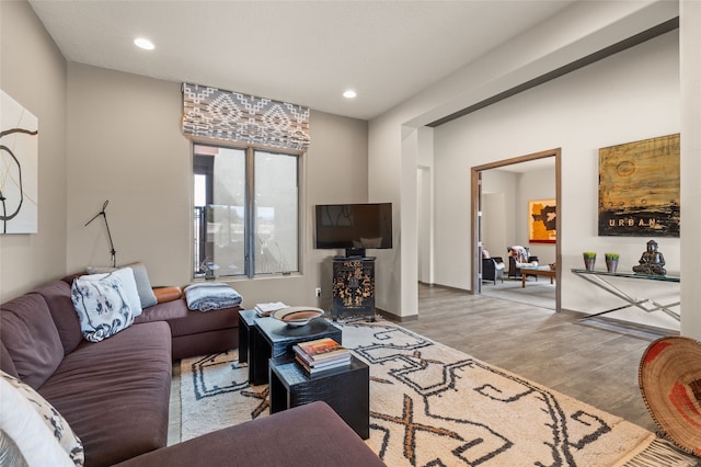 living room featuring recessed lighting and wood finished floors