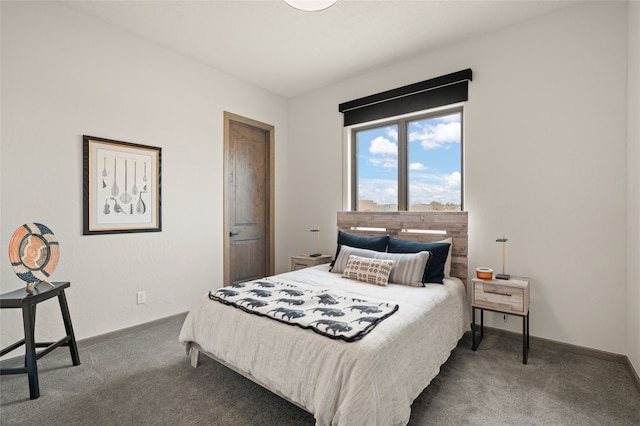 bedroom featuring carpet flooring and baseboards