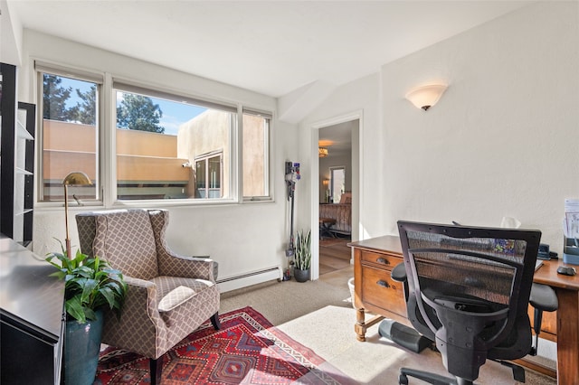 carpeted home office with a baseboard radiator