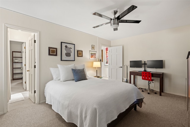 carpeted bedroom with baseboards and ceiling fan