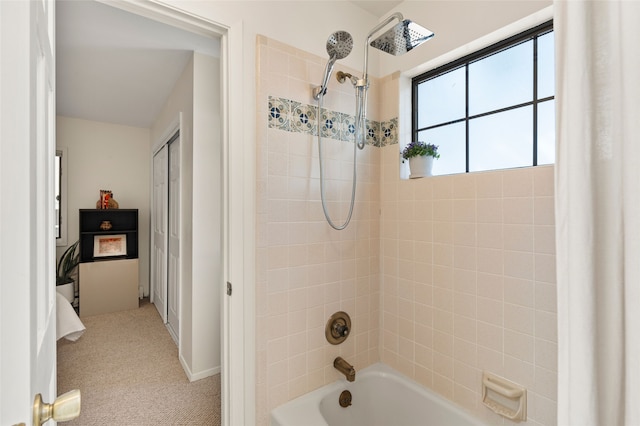 bathroom with bathing tub / shower combination