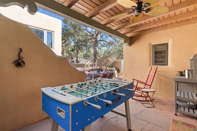 view of patio / terrace featuring ceiling fan and fence