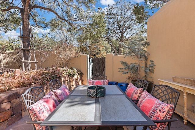 view of patio featuring outdoor dining space and a fenced backyard