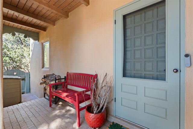 view of exterior entry with stucco siding