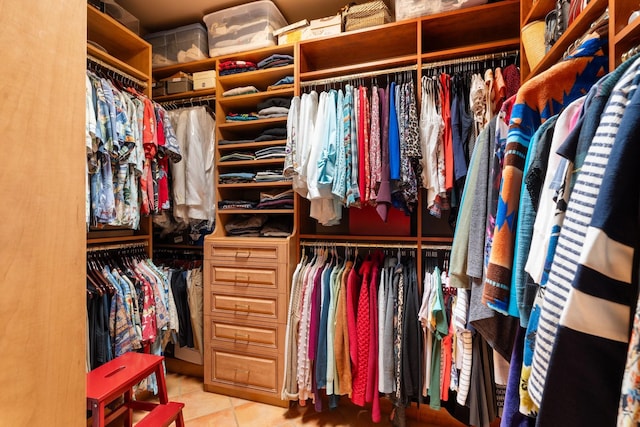 spacious closet featuring tile patterned floors