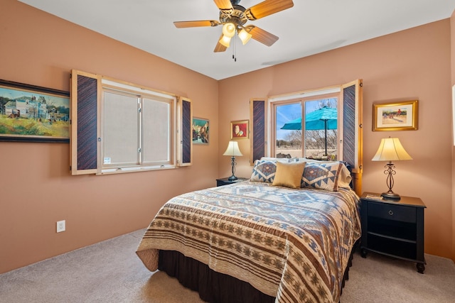 bedroom with ceiling fan and carpet floors