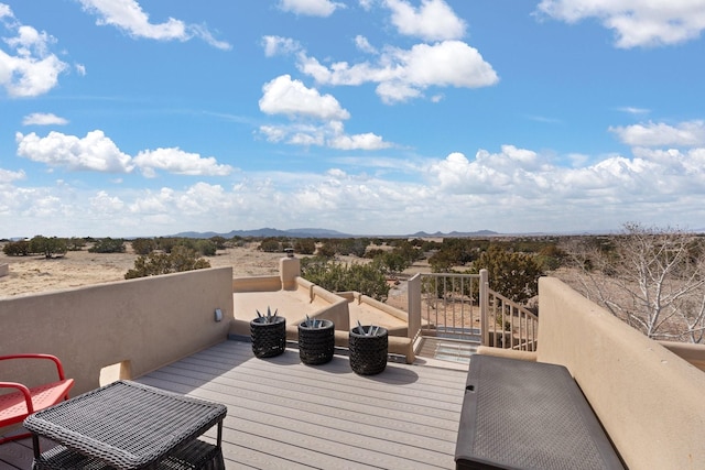 wooden deck featuring a mountain view