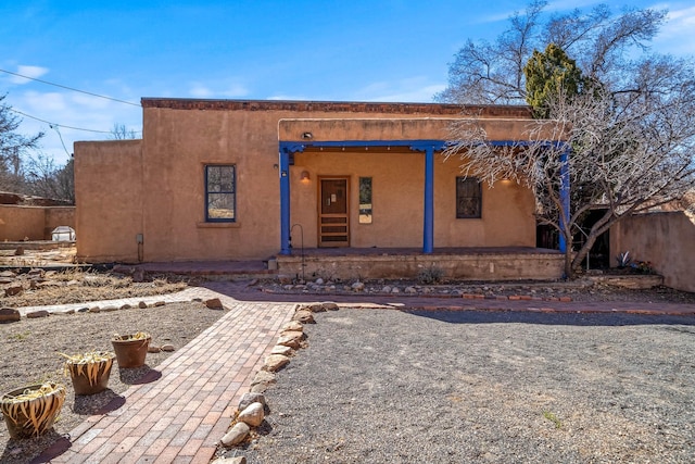 adobe home with stucco siding