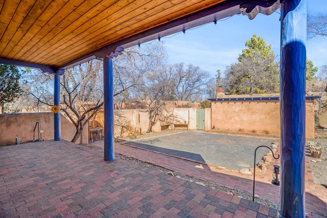 view of patio with fence private yard and a gate