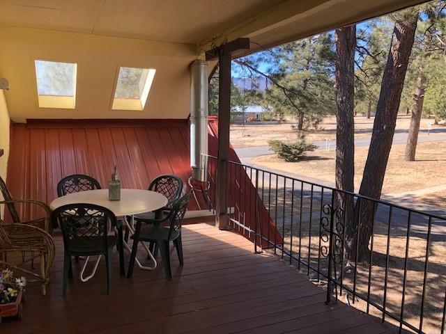 deck with outdoor dining space