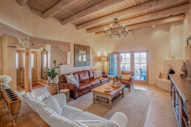 living room featuring a chandelier, beamed ceiling, light tile patterned floors, wooden ceiling, and a high ceiling