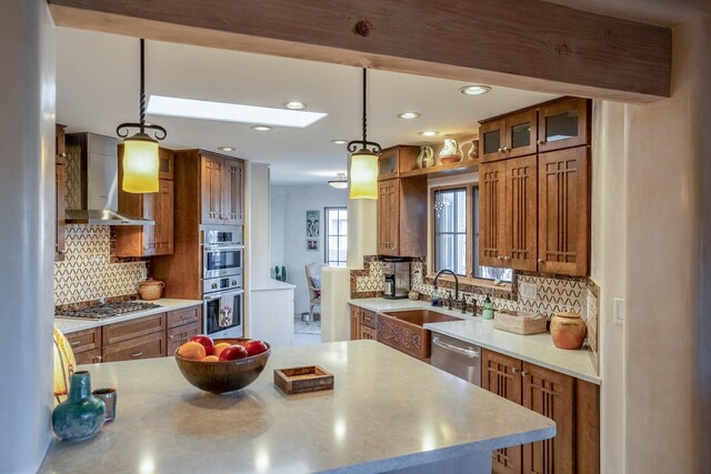 kitchen featuring dishwasher and brown cabinets