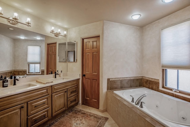 full bathroom with a sink, double vanity, a whirlpool tub, and tile patterned flooring