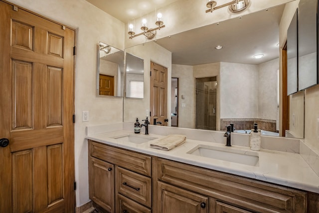 full bathroom featuring double vanity, a shower stall, and a sink