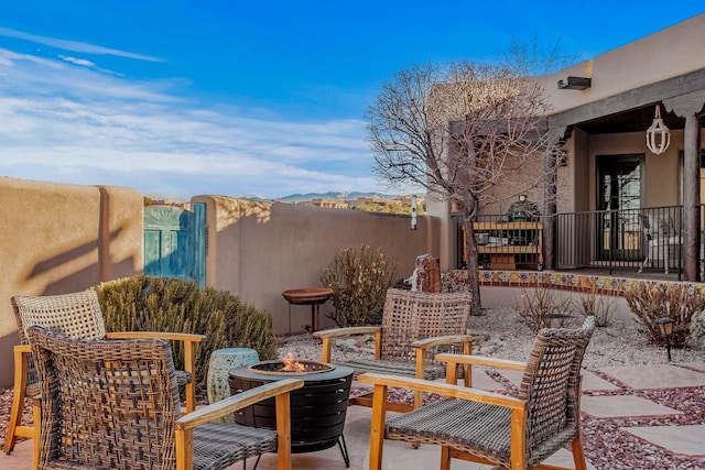 view of patio / terrace featuring an outdoor fire pit