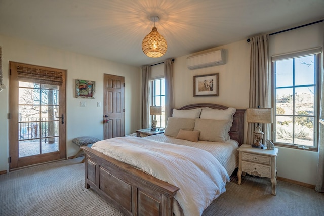 bedroom with baseboards, light carpet, an AC wall unit, and access to outside