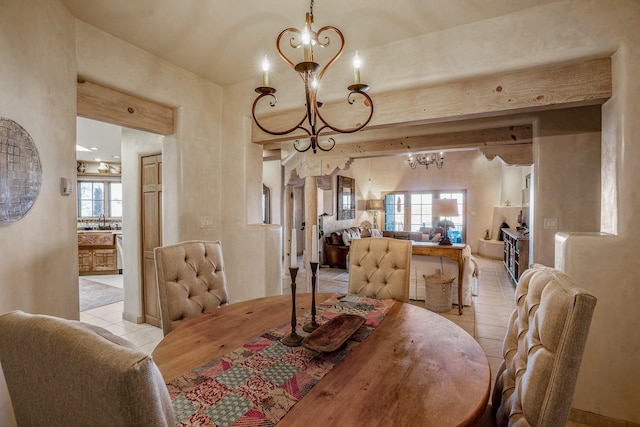 dining area featuring a chandelier, light tile patterned floors, and a wealth of natural light