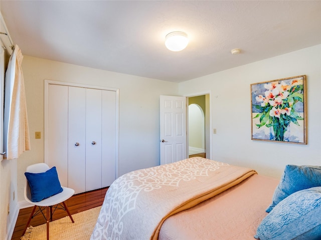 bedroom featuring a closet and wood finished floors