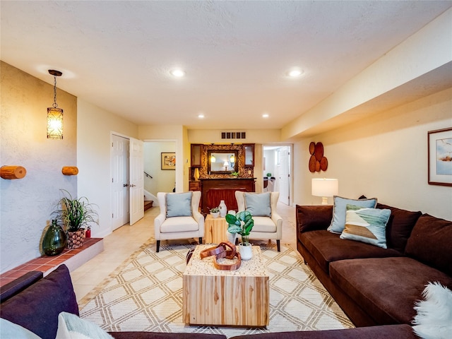 living area with recessed lighting and visible vents