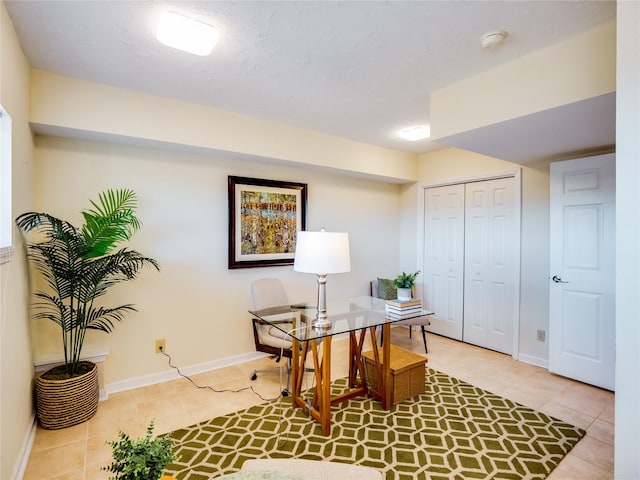 office with light tile patterned floors and baseboards