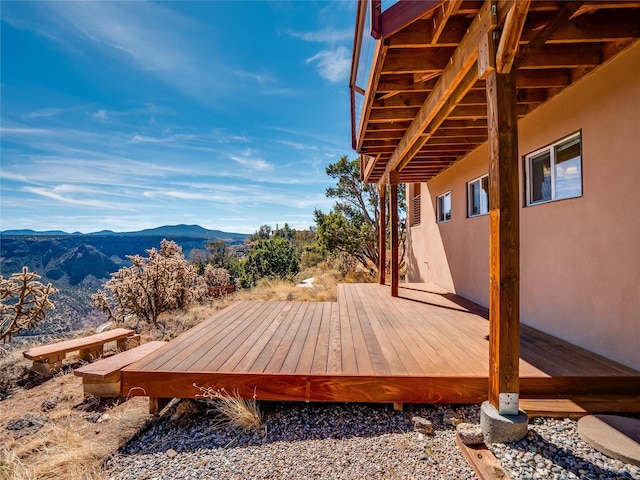 wooden terrace featuring a mountain view