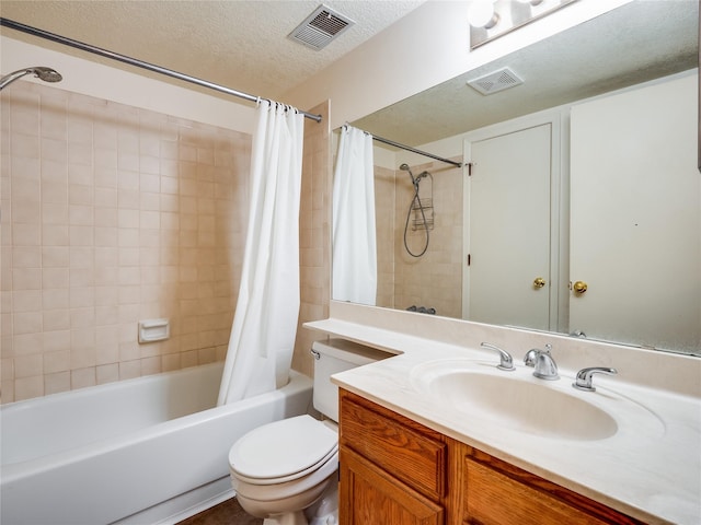 bathroom featuring vanity, visible vents, shower / tub combo with curtain, and a textured ceiling