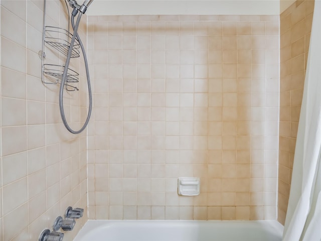 bathroom featuring shower / bathtub combination with curtain