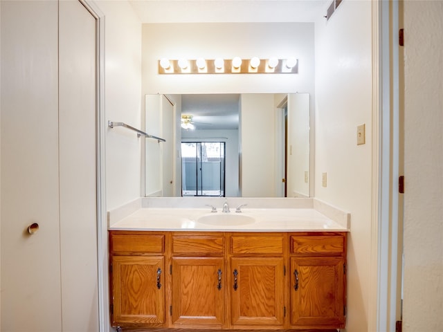 bathroom featuring a ceiling fan and vanity