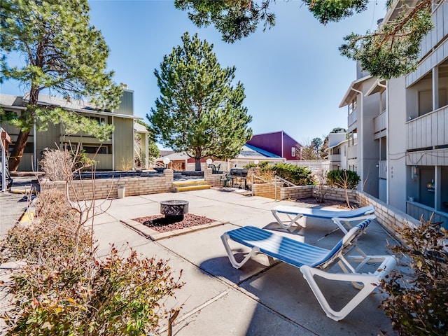 view of patio with an outdoor fire pit