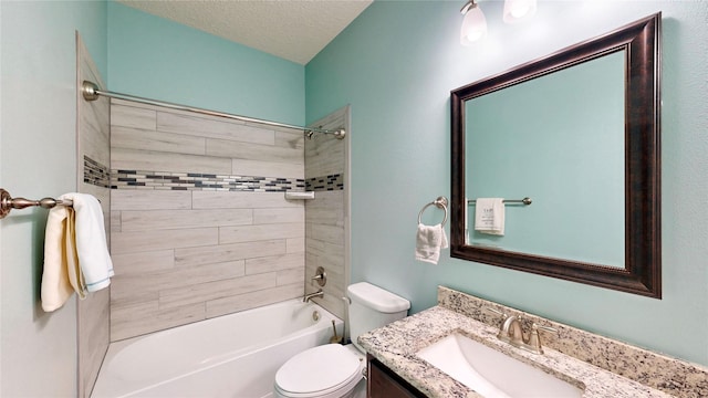 bathroom with tub / shower combination, a textured ceiling, toilet, and vanity