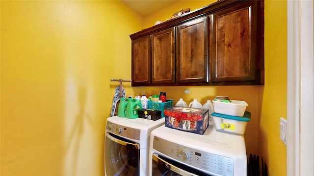 laundry area featuring cabinet space and separate washer and dryer