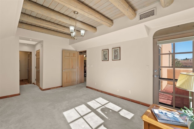 3101 Old Pecos Trl Unit 219, Santa Fe, NM 87505 - interior space with beam ceiling, visible vents, carpet, baseboards, and wood ceiling