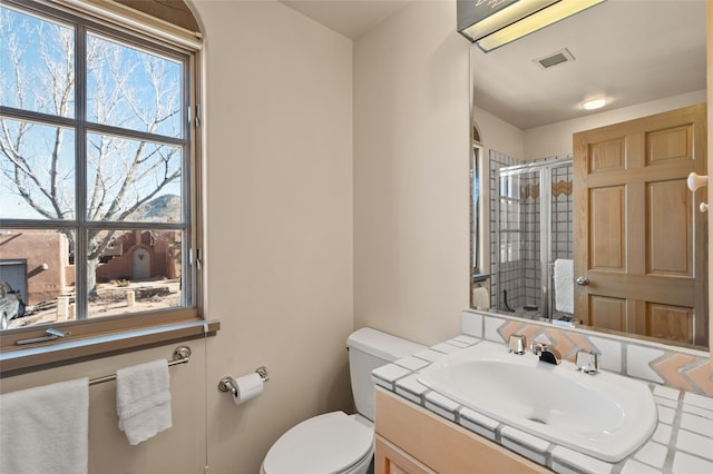 3101 Old Pecos Trl Unit 219, Santa Fe, NM 87505 - full bath with visible vents, a stall shower, toilet, and vanity