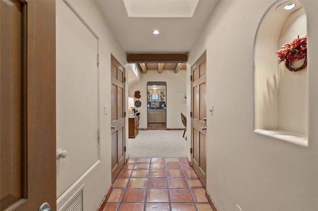 3101 Old Pecos Trl Unit 219, Santa Fe, NM 87505 - hallway featuring light colored carpet, visible vents, beam ceiling, light tile patterned flooring, and recessed lighting