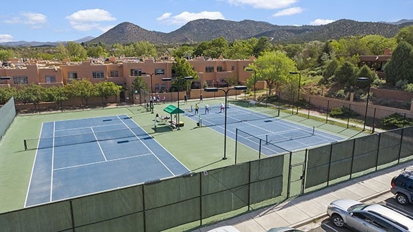 3101 Old Pecos Trl Unit 219, Santa Fe, NM 87505 - view of sport court with fence and a mountain view