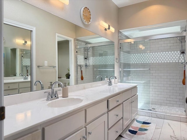 full bath featuring a shower stall, double vanity, marble finish floor, and a sink